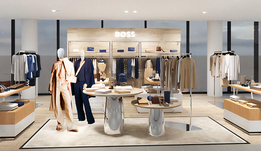 The inside of a Hugo Boss store with manequins and display shelves with women’s clothing (photo)