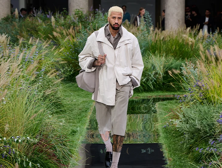 A male model at a fashion show outside (photo)